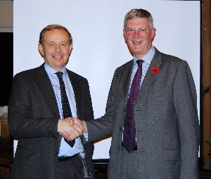Russell Searle (l), chapter president, thanks Brig. David Meyer, BA, chief information officer, J6, Director Communications and Battlespace Management, for speaking at the October event.